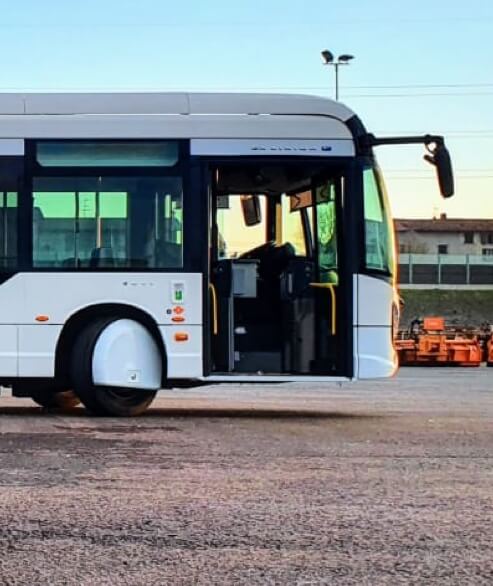 Side view of an Electreon electric bus wirelessly charging