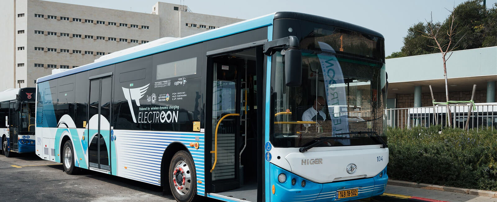 Bus at a wireless EV charging station